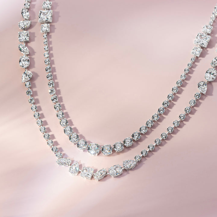Laureate: Silver rhodium plated multi-shaped princess and round CZ, 32 1/8" long necklace