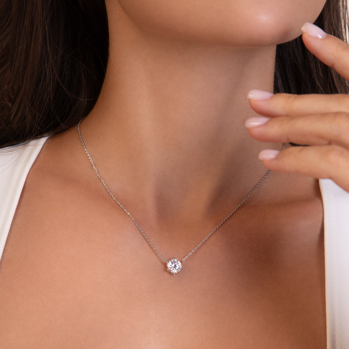 100 Cuts: Silver rhodium plated 8 mm round cut 100 facet CZ solitaire pendant with 16" necklace