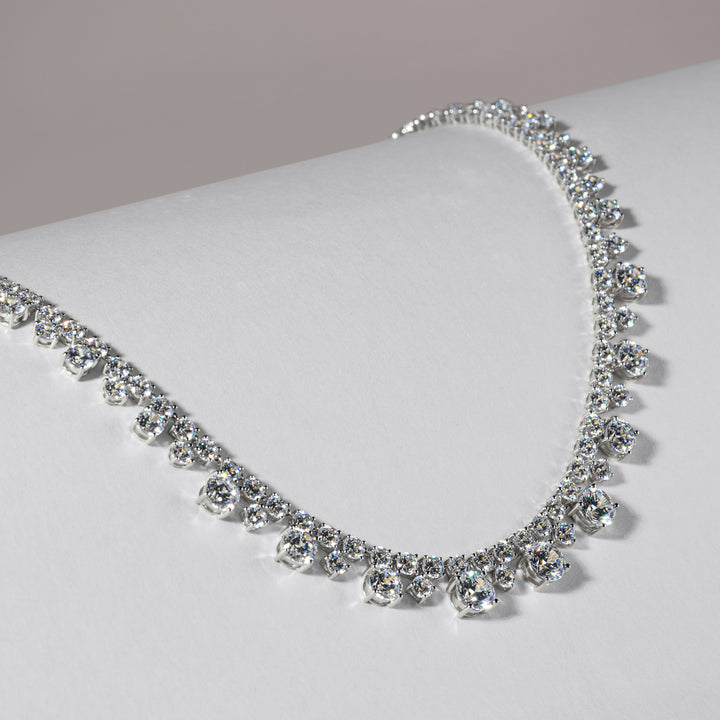 100 Cuts: Silver rhodium plated round cut 100 facet CZ with 16" riviere tennis necklace