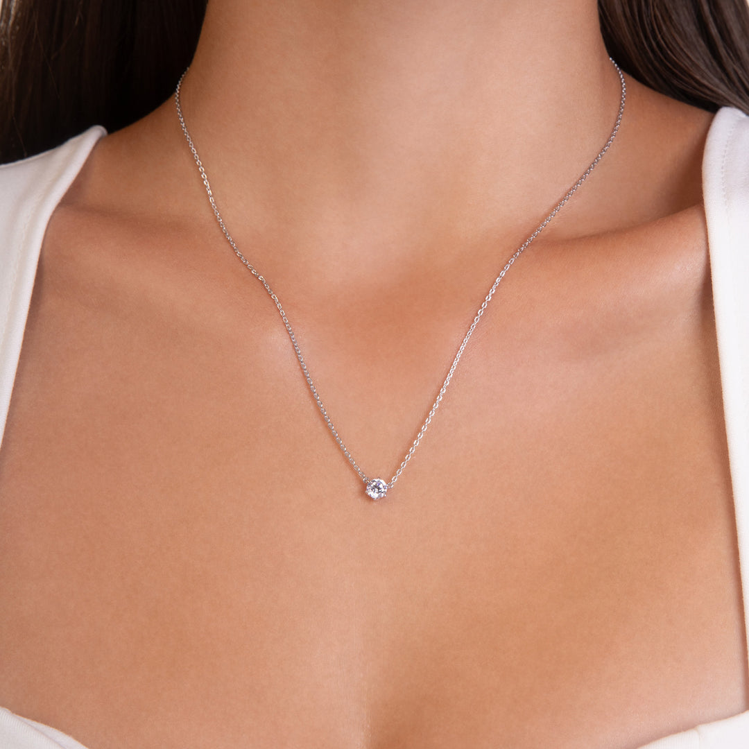 100 Cuts: Silver rhodium plated 5 mm round cut 100 facet CZ solitaire pendant with 16" necklace