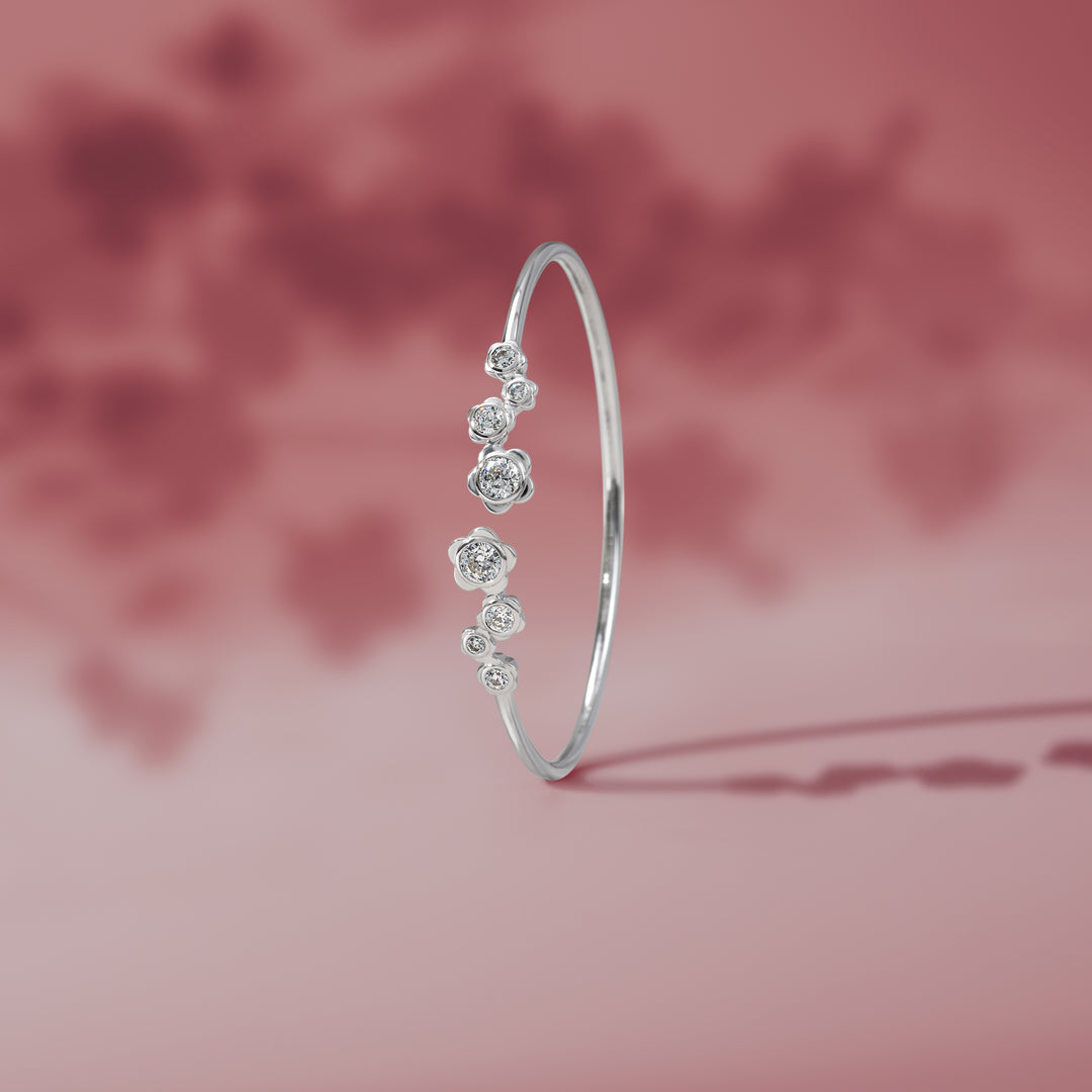 Forget Me Not: Silver rhodium plated with CZ flower bangle
