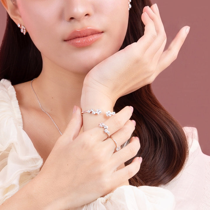 Forget Me Not: Silver rhodium plated 4.25 mm round cut CZ flower ring