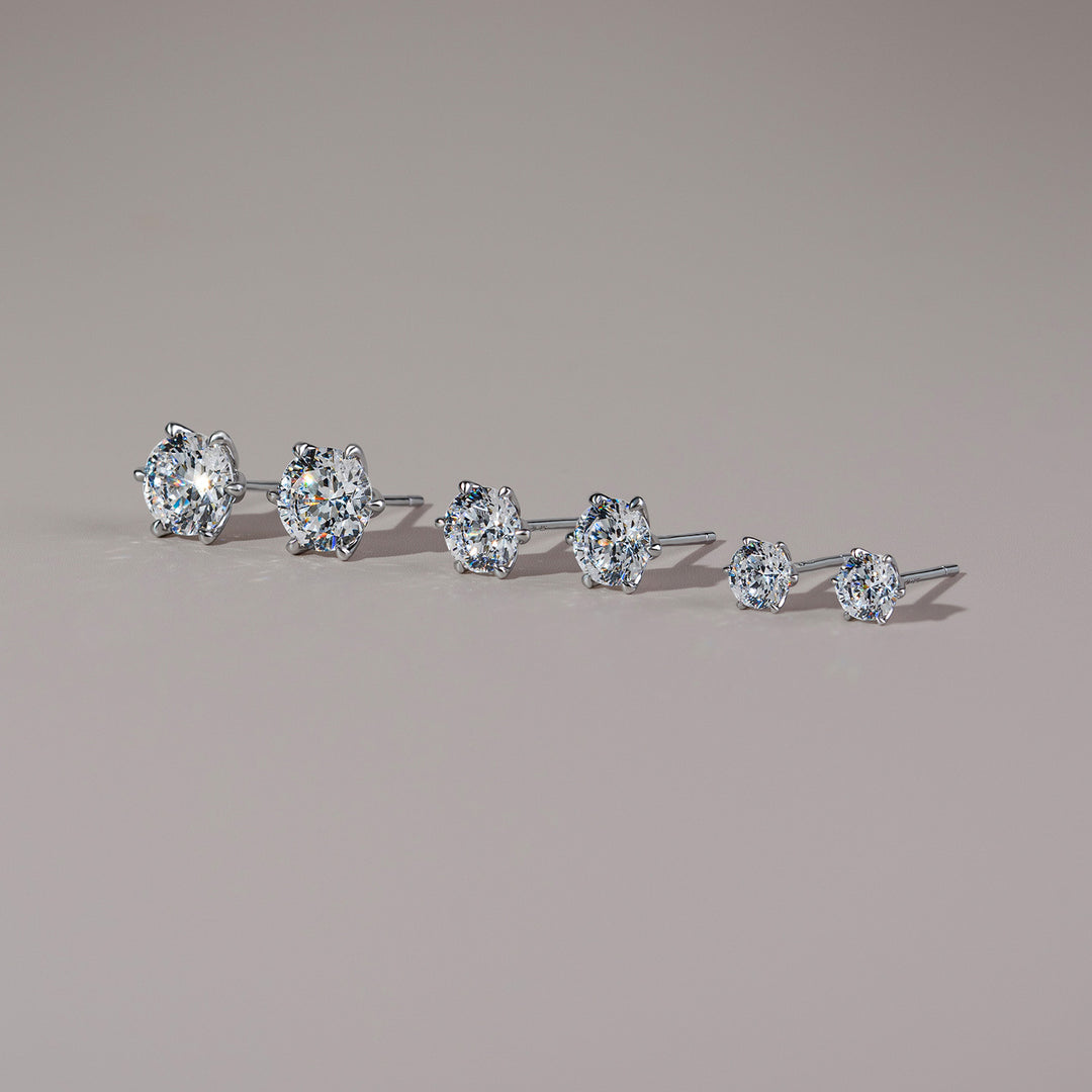 100 Cuts: Silver rhodium plated 8 mm round cut 100 facet CZ classic stud earrings