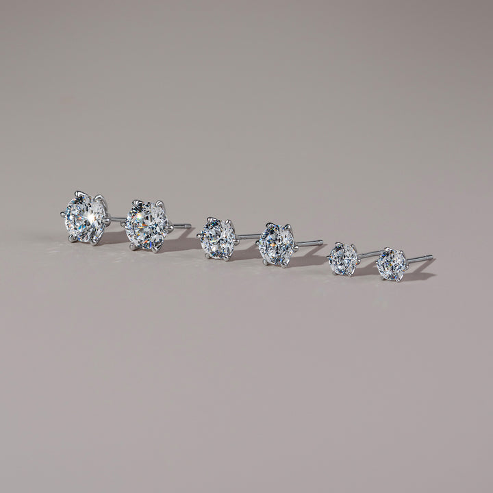 100 Cuts: Silver rhodium plated 6.5 mm round cut 100 facet CZ classic stud earrings