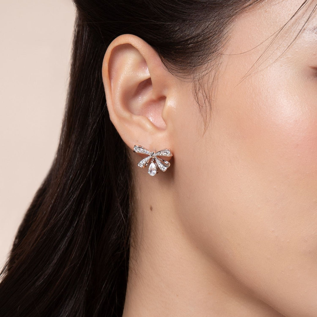 Ballerina: Sterling Silver Rhodium Plated Pear Cut CZ Bow Stud Earrings