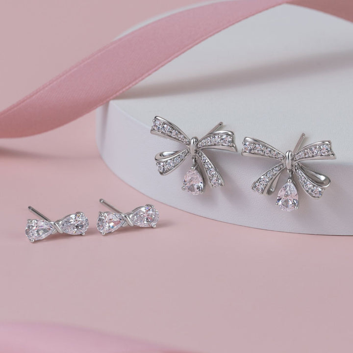 Ballerina: Sterling Silver Rhodium Plated Pear Cut CZ Bow Stud Earrings