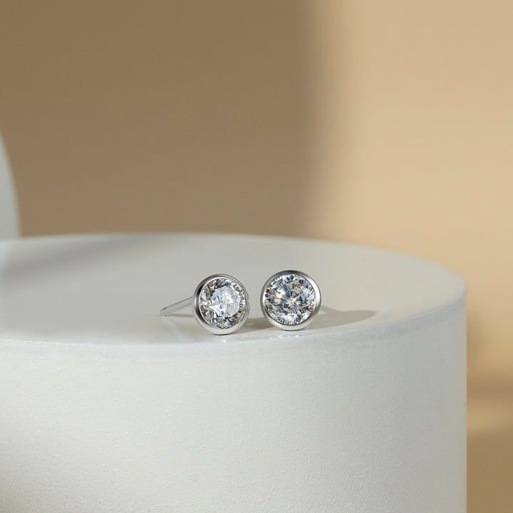 Little piece of me: Silver Rhodium Plated with 100 Facets Round CZ Bezel Set Stud Earrings