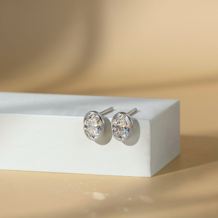 Little piece of me: Silver Rhodium Plated with Oval CZ Bezel Set Stud Earrings