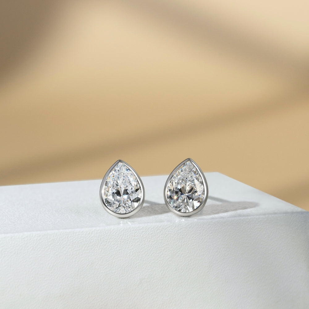 Little piece of me: Silver Rhodium Plated with Pear CZ Bezel Set Stud Earrings