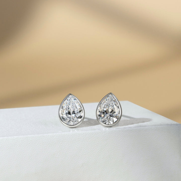 Little piece of me: Silver Rhodium Plated with Pear CZ Bezel Set Stud Earrings
