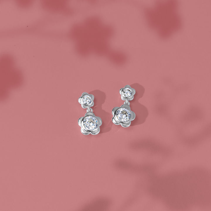 Forget Me Not: Silver rhodium plated 4.25 mm round cut CZ flower drop drop earrings
