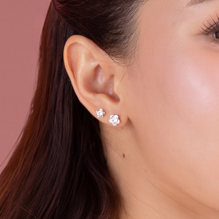 Forget Me Not: Silver rhodium plated 4.25 mm round cut CZ flowers stud earrings