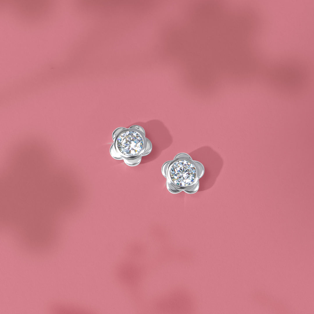 Forget Me Not: Silver rhodium plated 4.25 mm round cut CZ flowers stud earrings