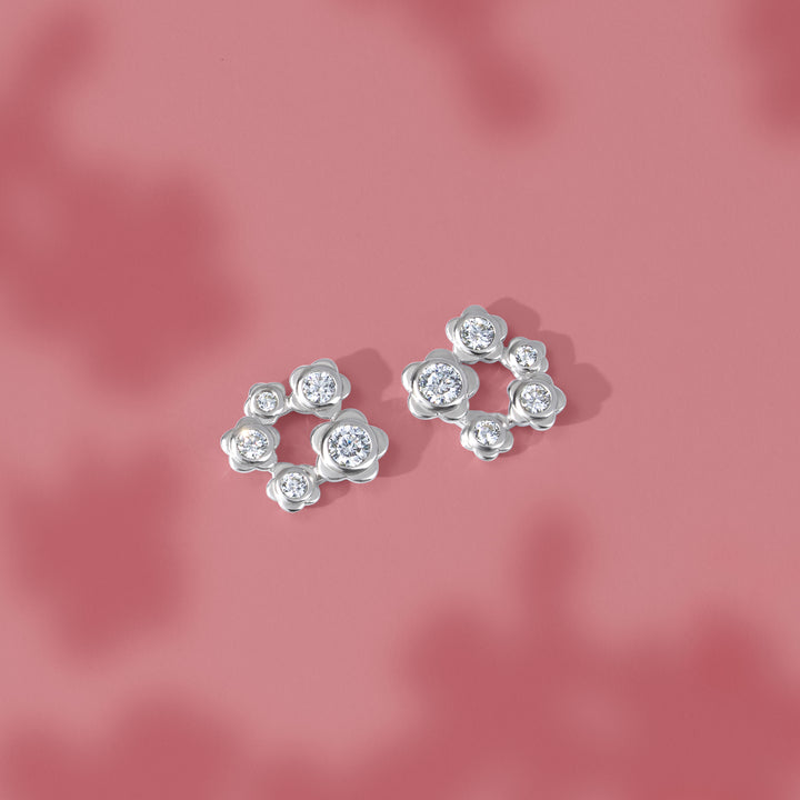 Forget Me Not: Silver rhodium plated 3.25 mm round cut CZ flowers stud earrings