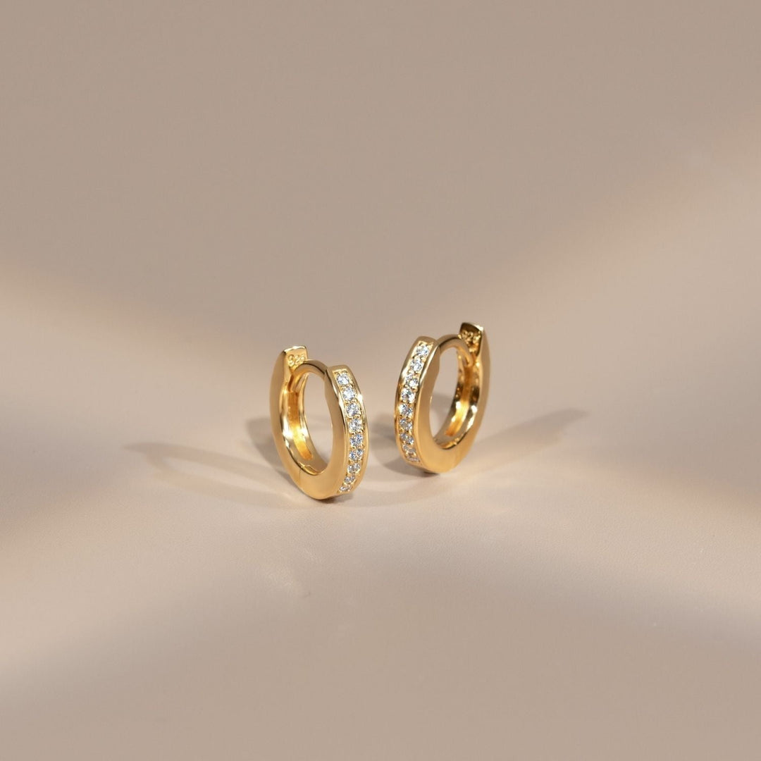 221E3514-01-Little-Piece-of-Me-23K-Gold-Plated-Silver-Huggie-Earrings-with-CZ