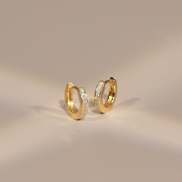 221E3514-01-Little-Piece-of-Me-23K-Gold-Plated-Silver-Huggie-Earrings-with-CZ