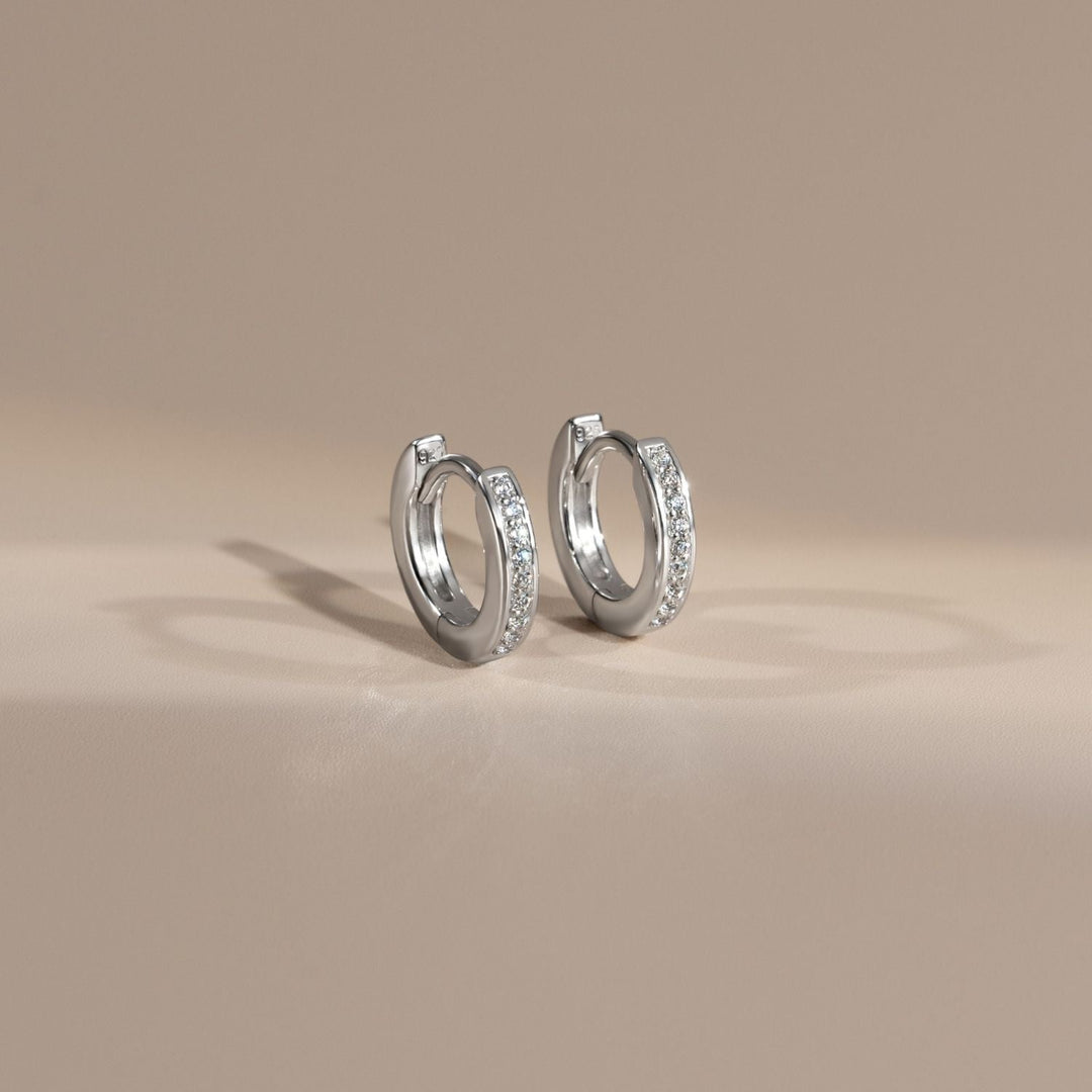 221E3515-01-Little-Piece-of-Me-Silver-Rhodium-Huggie-Earrings-with-CZ