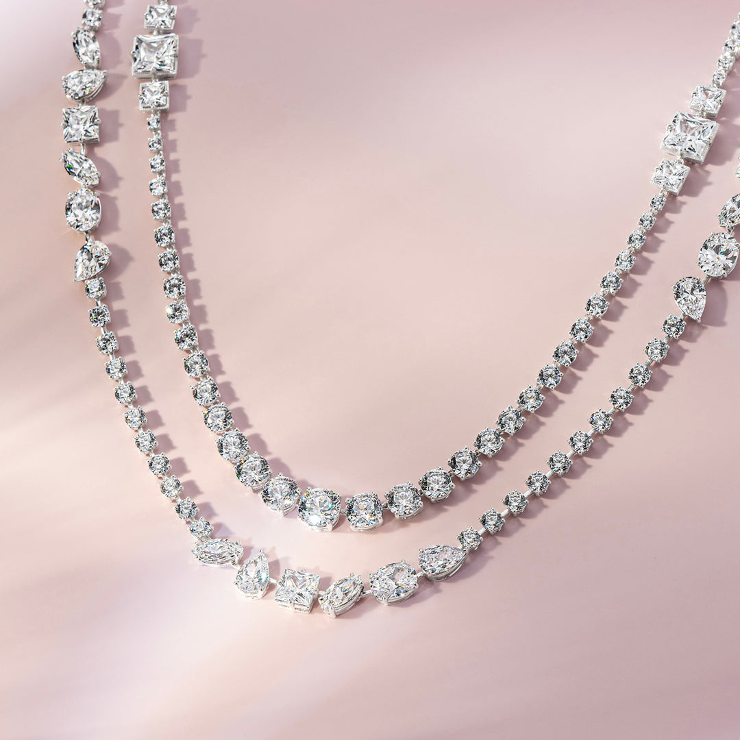 Laureate: Silver rhodium plated multi-shaped marquise and pear CZ, 32 1/8" long necklace