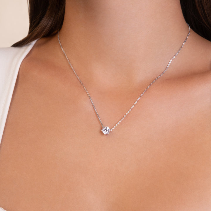 100 Cuts: Silver rhodium plated 6.5 mm round cut 100 facet CZ solitaire pendant with 16" necklace