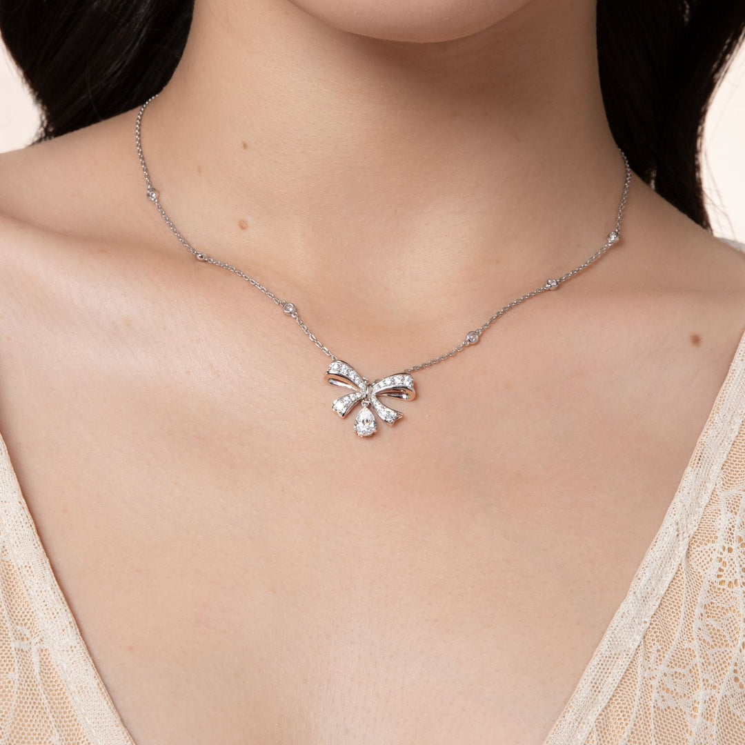 Ballerina: Sterling Silver Rhodium Plated Pear Cut CZ Bow Necklace