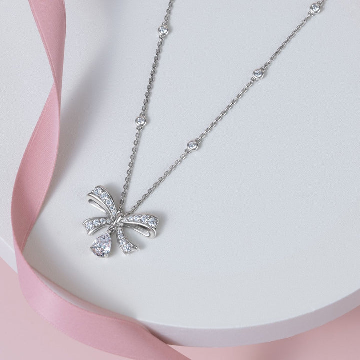 Ballerina: Sterling Silver Rhodium Plated Pear Cut CZ Bow Necklace