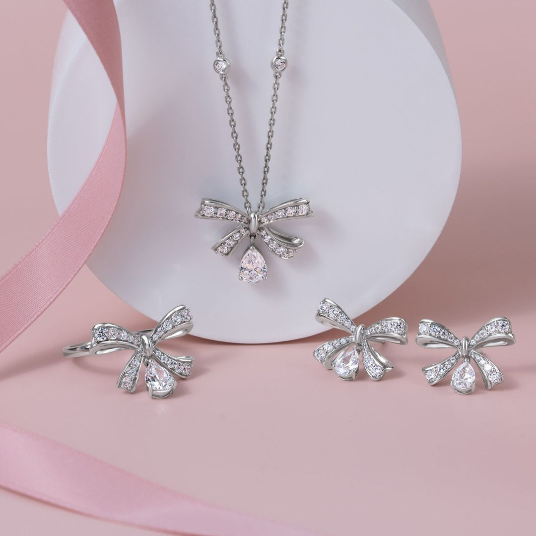 Ballerina: Sterling Silver Rhodium Plated Pear Cut CZ Bow Necklace
