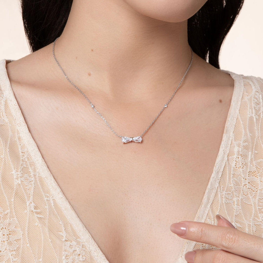 Ballerina: Sterling Silver Rhodium Plated CZ Pear Cut Infinity Bow Necklace