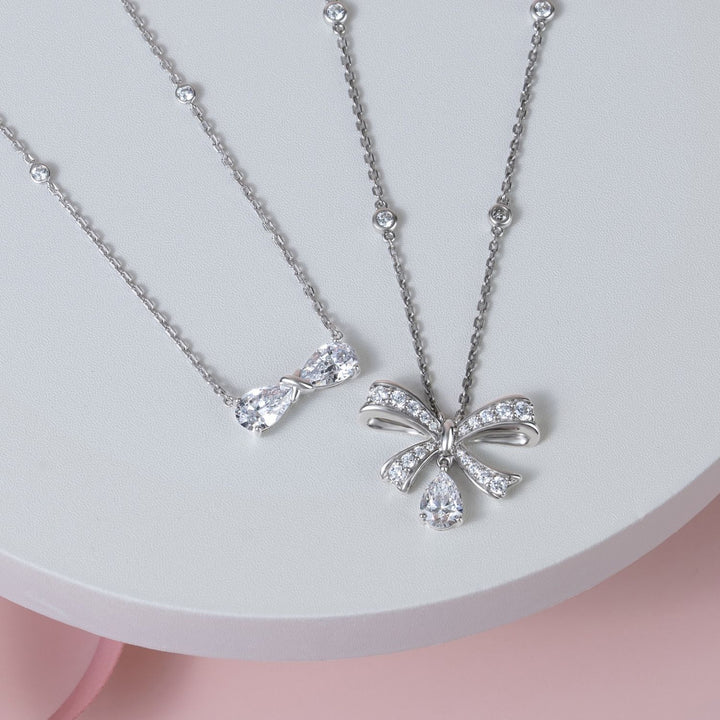Ballerina: Sterling Silver Rhodium Plated CZ Pear Cut Infinity Bow Necklace