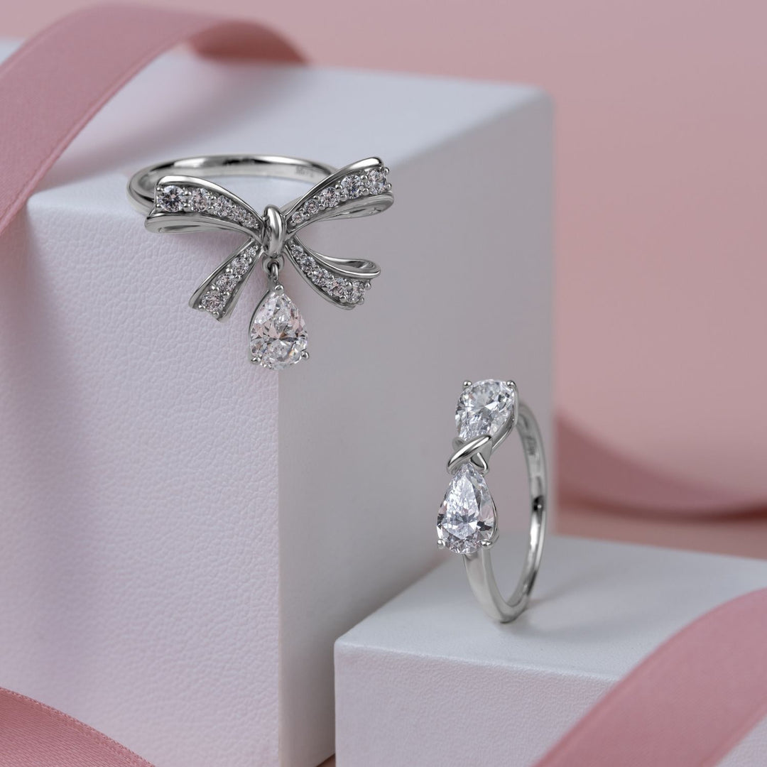 Ballerina: Sterling Silver Rhodium Plated Pear Cut CZ Bow Ring