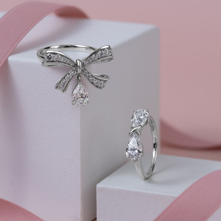 Ballerina: Sterling Silver Rhodium Plated Pear Cut CZ Bow Ring