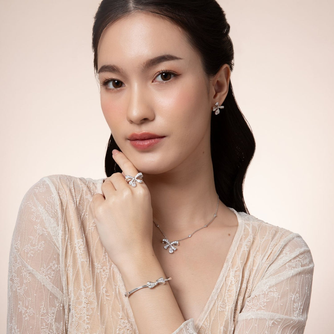 Ballerina: Sterling Silver Rhodium Plated Pear Cut CZ Bow Ring