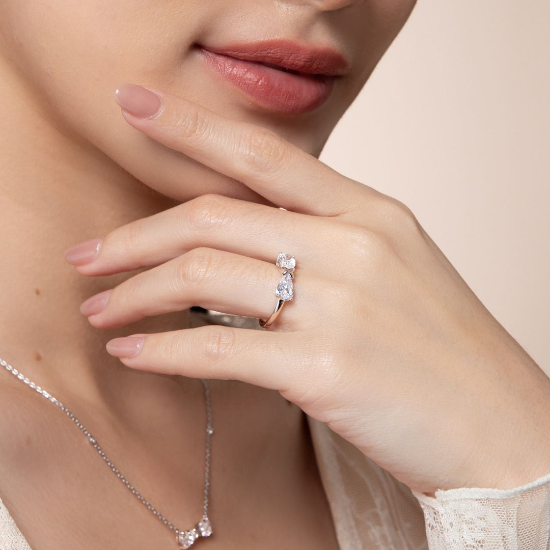 Ballerina: Sterling Silver Rhodium Plated CZ Pear Cut Infinity Bow Ring