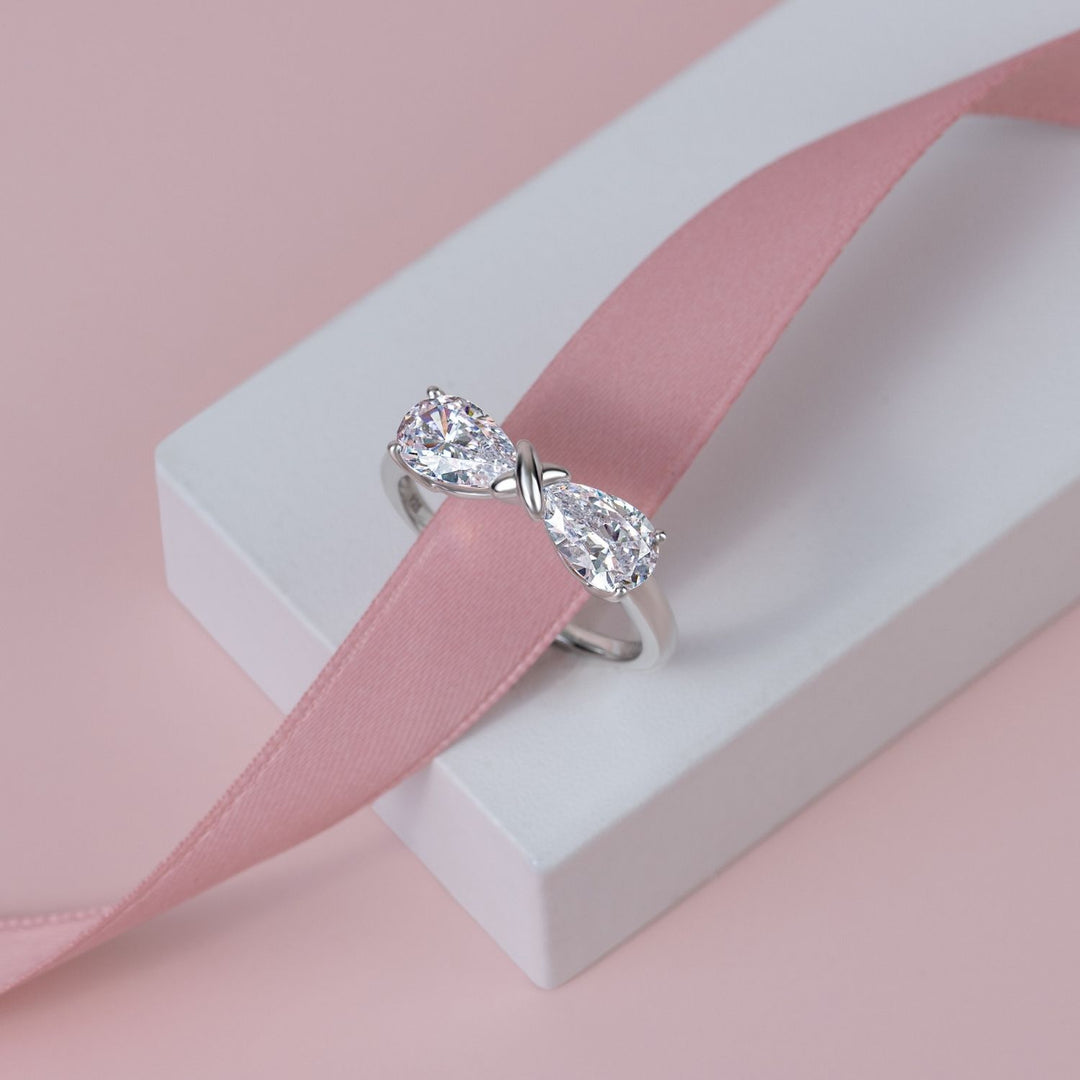 Ballerina: Sterling Silver Rhodium Plated CZ Pear Cut Infinity Bow Ring