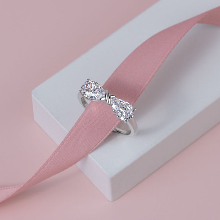 Ballerina: Sterling Silver Rhodium Plated CZ Pear Cut Infinity Bow Ring