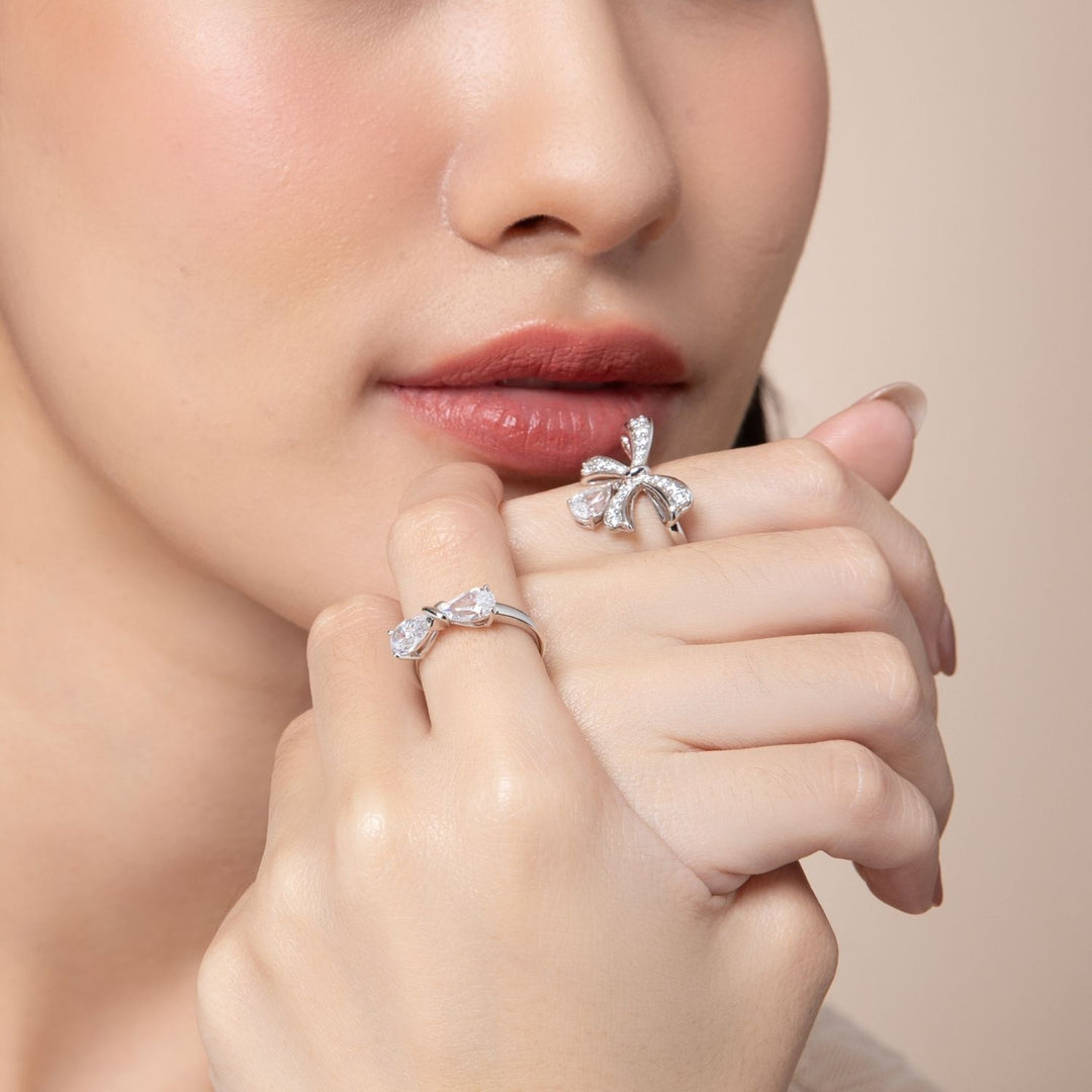 Ballerina: Sterling Silver Rhodium Plated CZ Pear Cut Infinity Bow Ring
