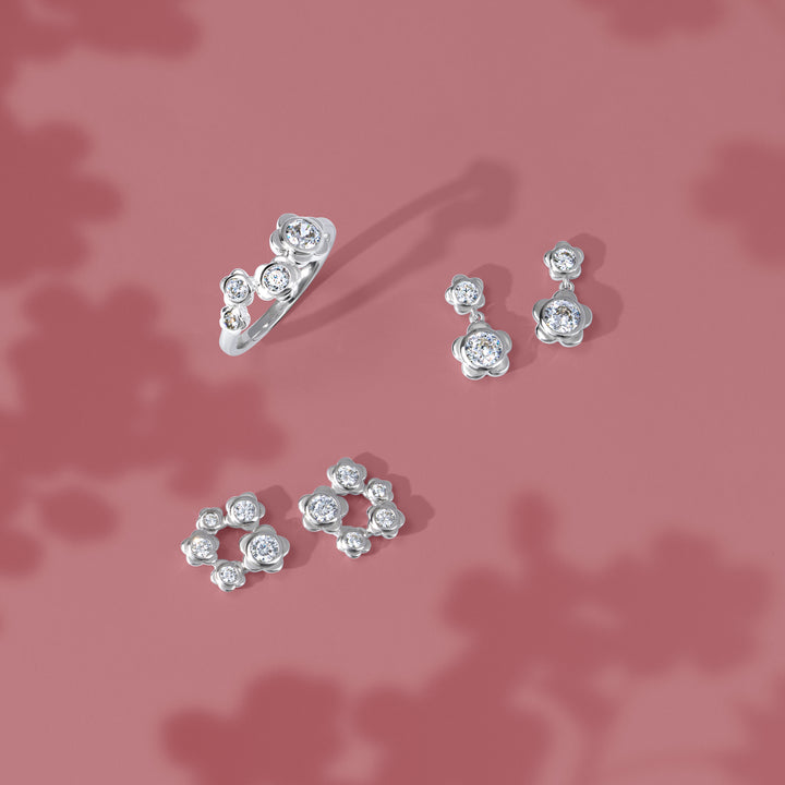 Forget Me Not: Silver rhodium plated 3.25 mm round cut CZ flowers stud earrings