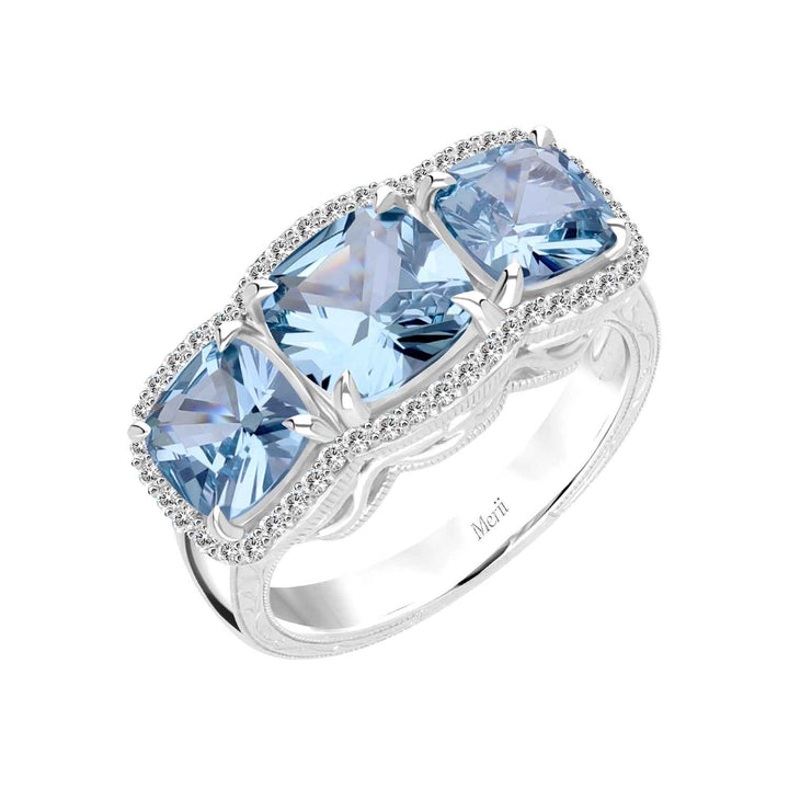 Decorum: Sterling Silver Rhodium Plated Triple Synthetic Aquamarine Spinel Cushion and CZ Ring