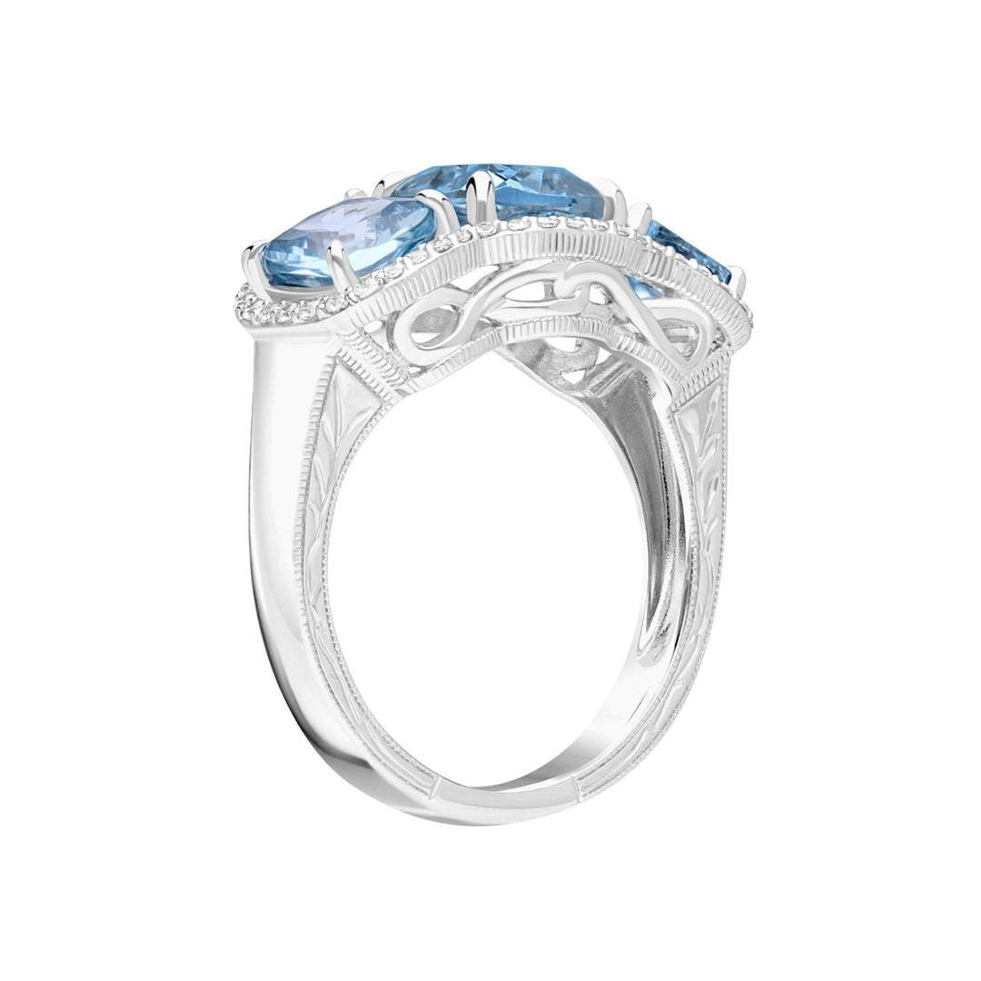 Decorum: Sterling Silver Rhodium Plated Triple Synthetic Aquamarine Spinel Cushion and CZ Ring