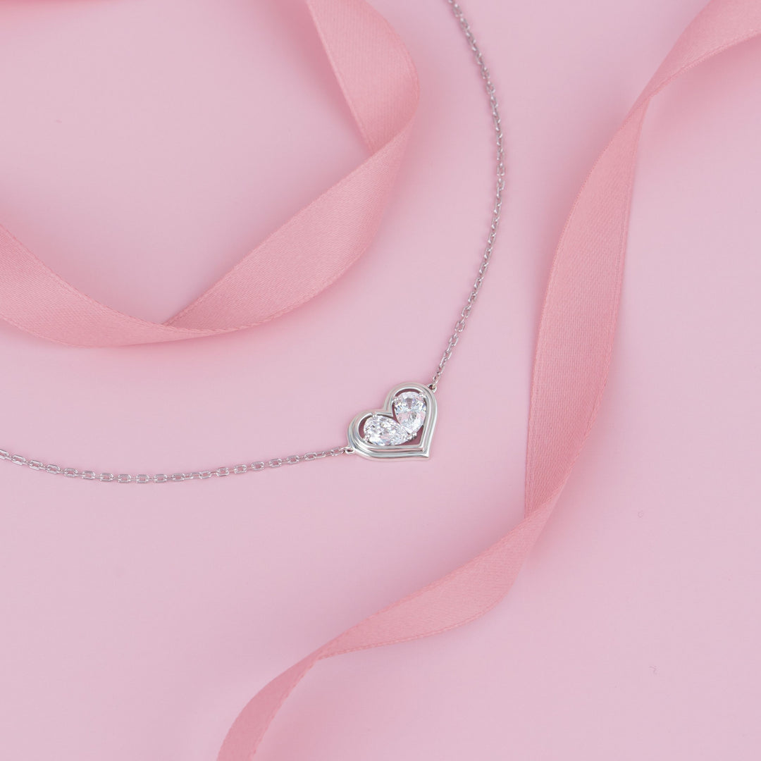 To Have and To Hold: Rhodium Plated 925 Sterling Silver Heart Bracelet with Pear Cut Cubic Zirconia