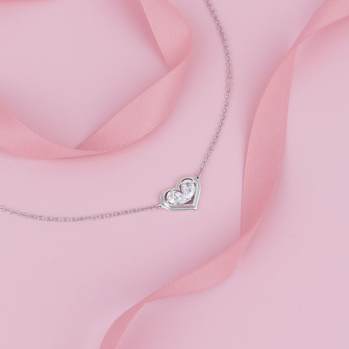 To Have and To Hold: Rhodium Plated 925 Sterling Silver Heart Bracelet with Pear Cut Cubic Zirconia