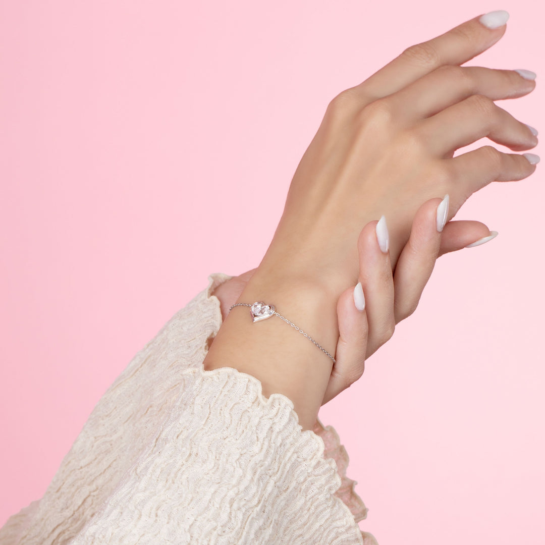 To Have and To Hold: Rhodium Plated 925 Sterling Silver Heart Bracelet with Pear Cut Cubic Zirconia