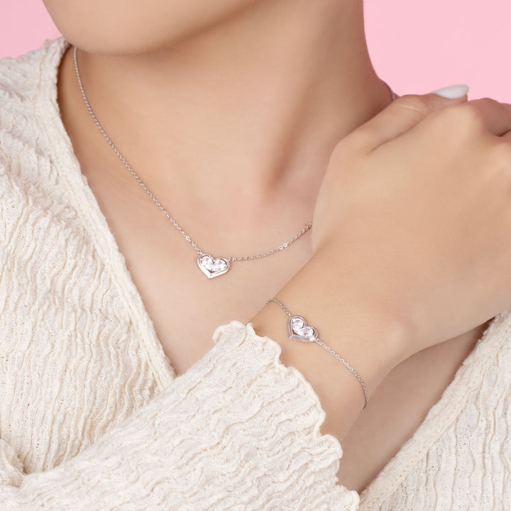 To Have and To Hold: Rhodium Plated 925 Sterling Silver Heart Bracelet with Pear Cut Cubic Zirconia