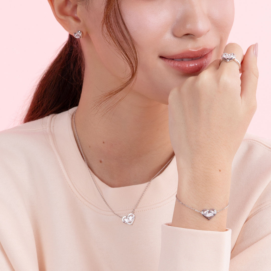 To Have and To Hold: Rhodium Plated 925 Sterling Silver Heart Earrings with Pear Cut Cubic Zirconia