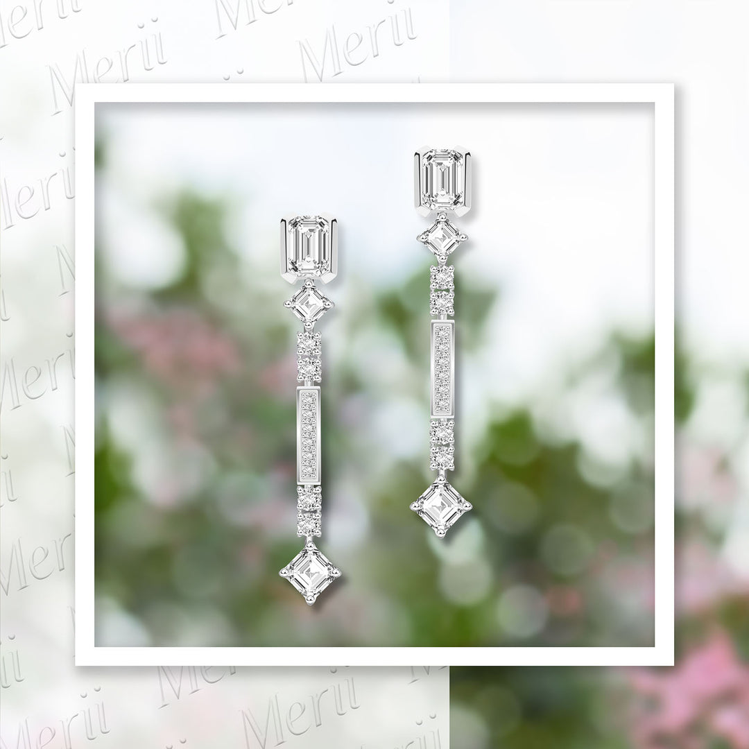 Quadri: Silver rhodium plated with CZ baguette cut channel and prong set  drop earrings