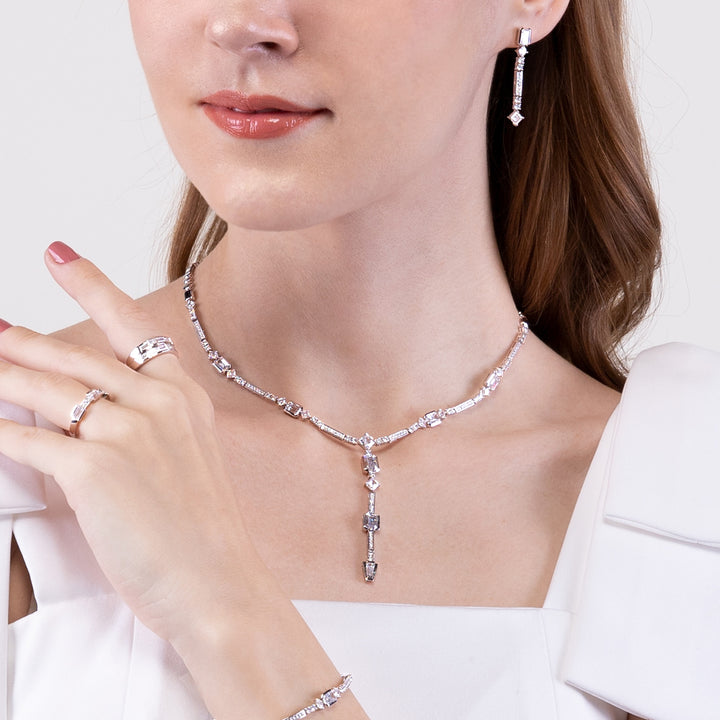 Quadri: Silver rhodium plated with baguette cut CZ channel and prong set  17 3/8" drop necklace